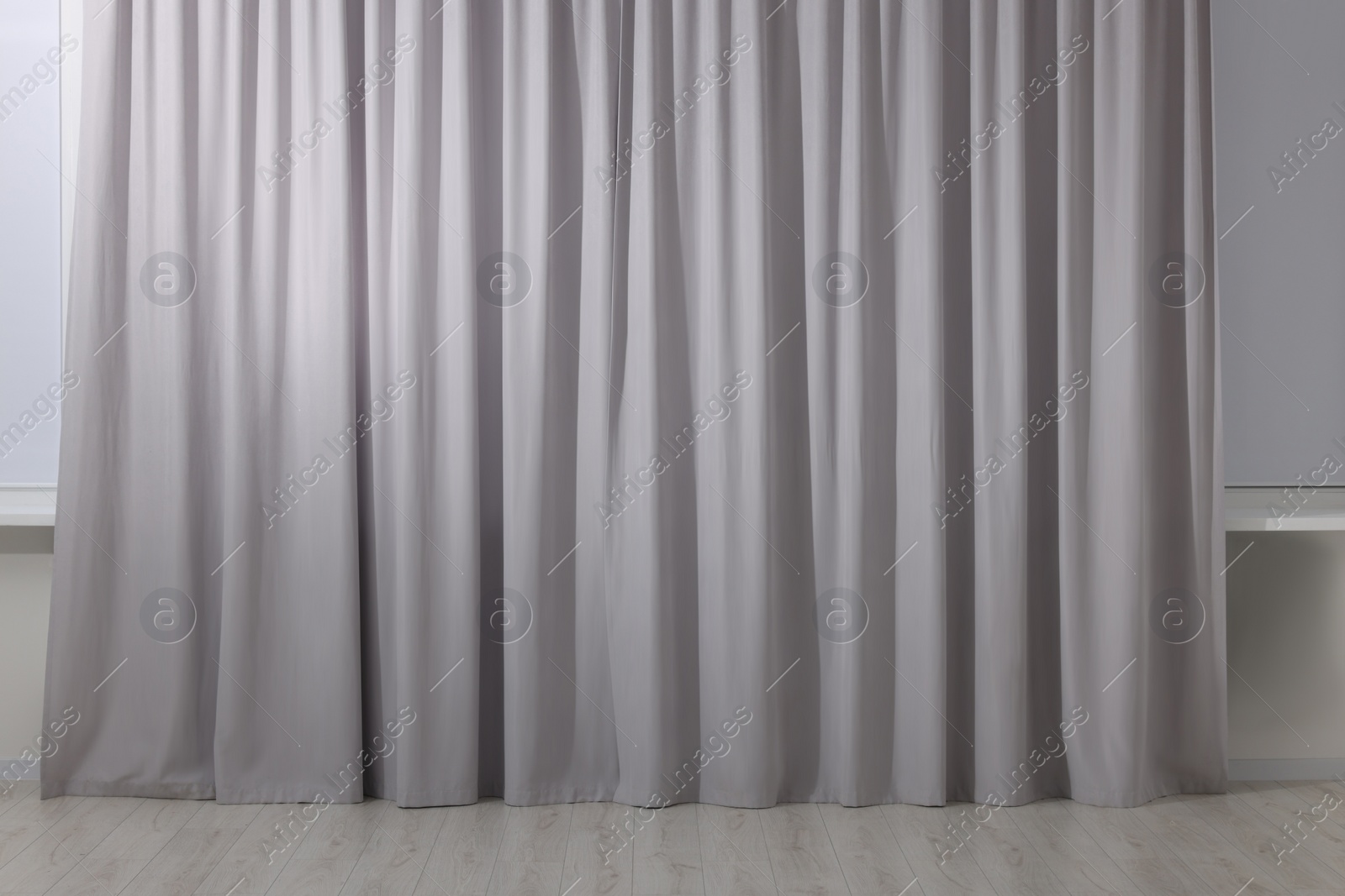 Photo of Light grey window curtains in living room