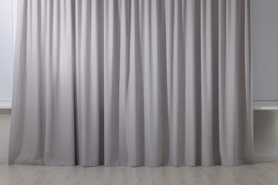 Photo of Light grey window curtains in living room