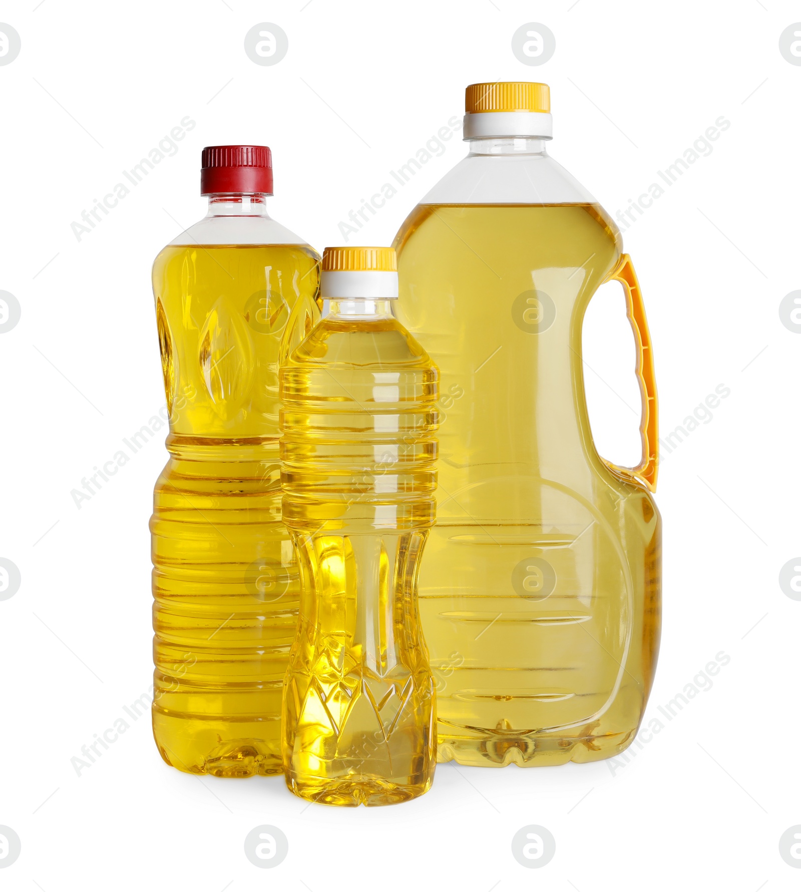 Photo of Bottles of cooking oil on white background