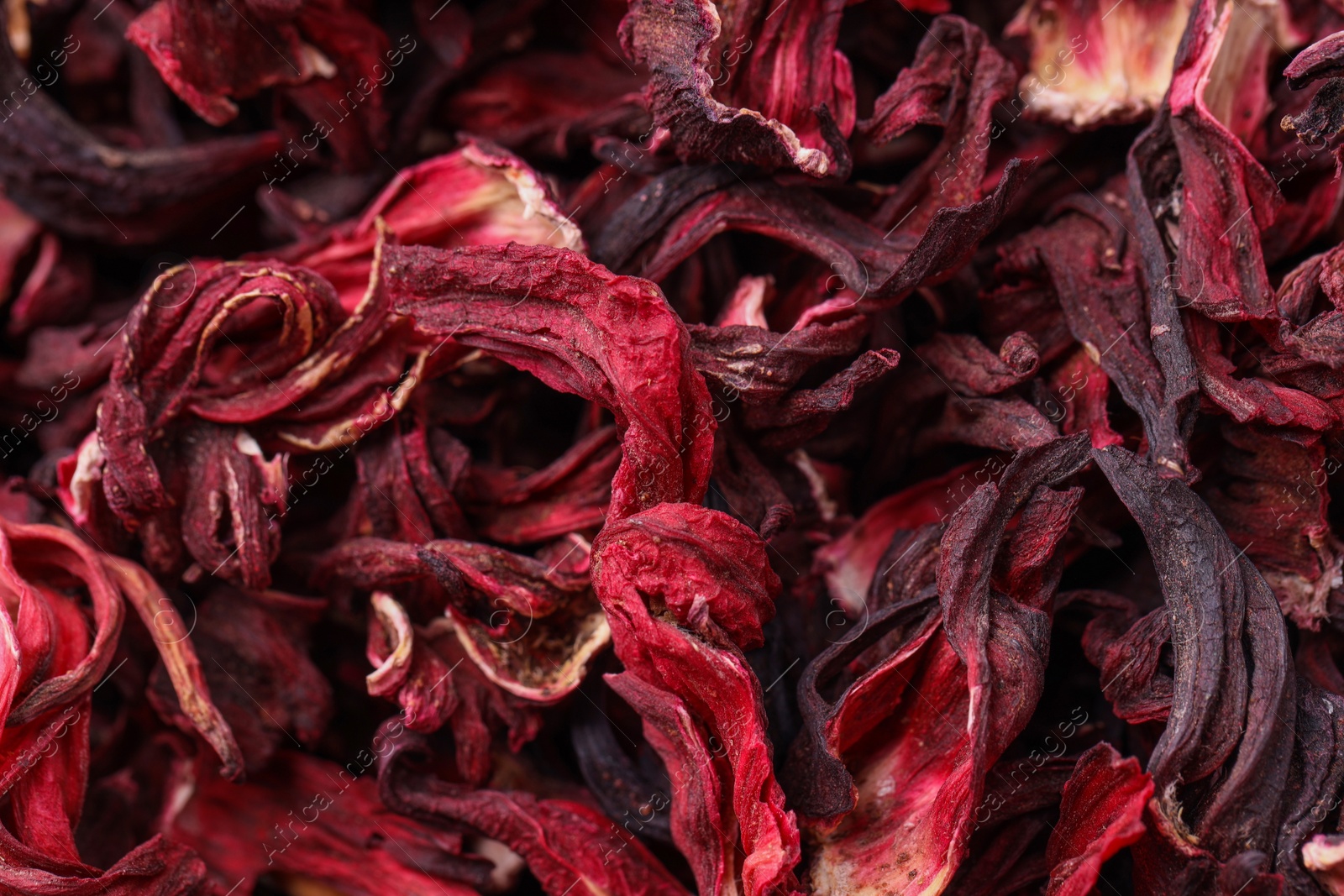 Photo of Dry hibiscus tea as background, closeup view