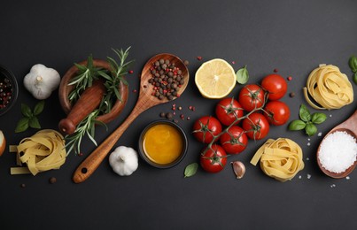 Photo of Flat lay composition with cooking utensils and fresh ingredients on black background