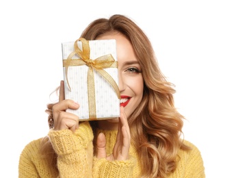 Photo of Happy young woman with Christmas gift on white background