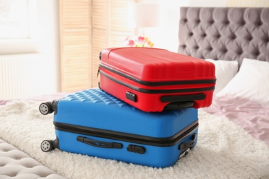 Photo of Travel suitcases on bed indoors