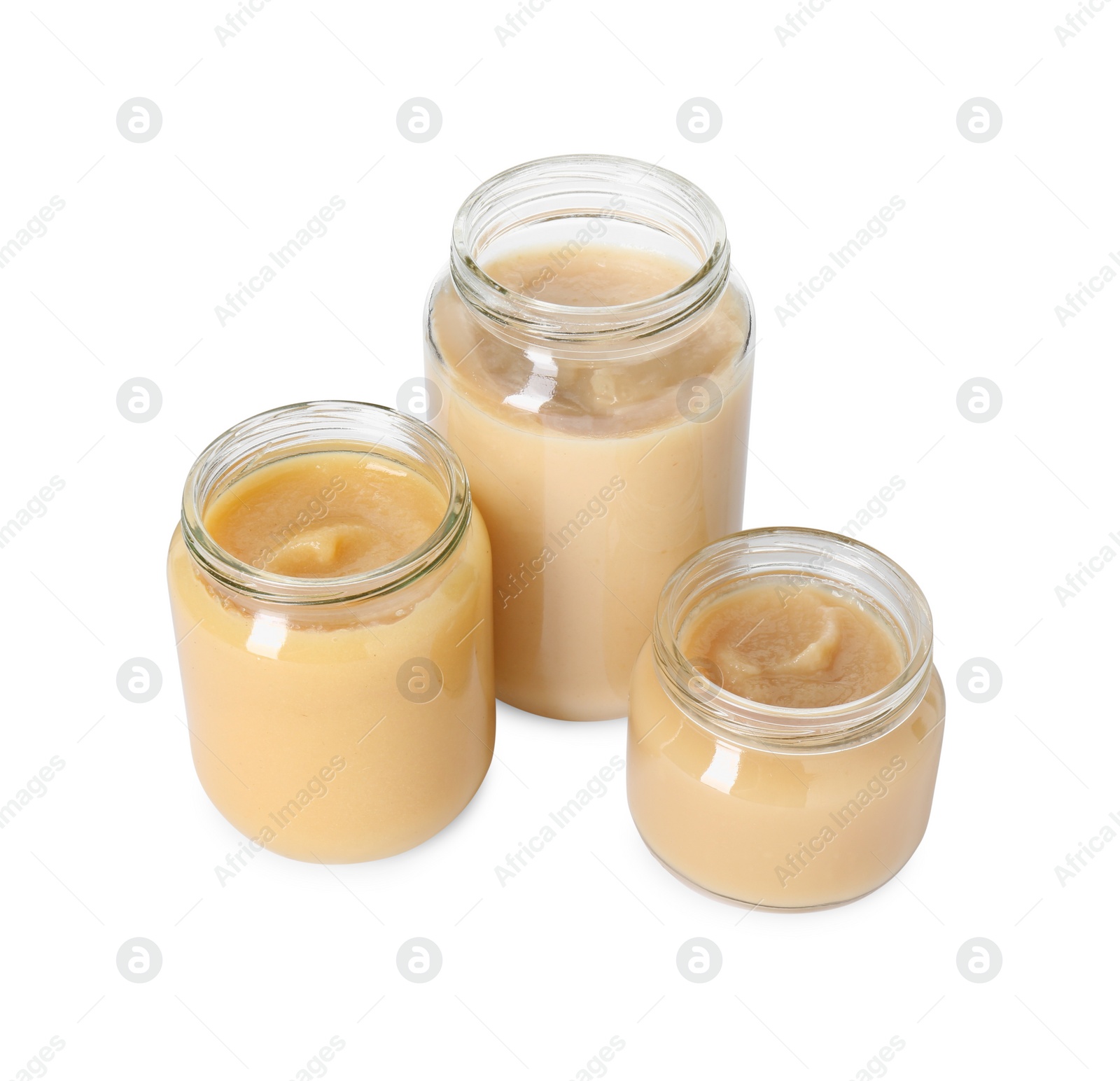 Photo of Baby food. Tasty healthy puree in jars isolated on white