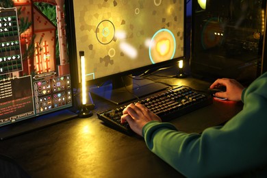 Photo of Man playing video games on computer indoors, closeup