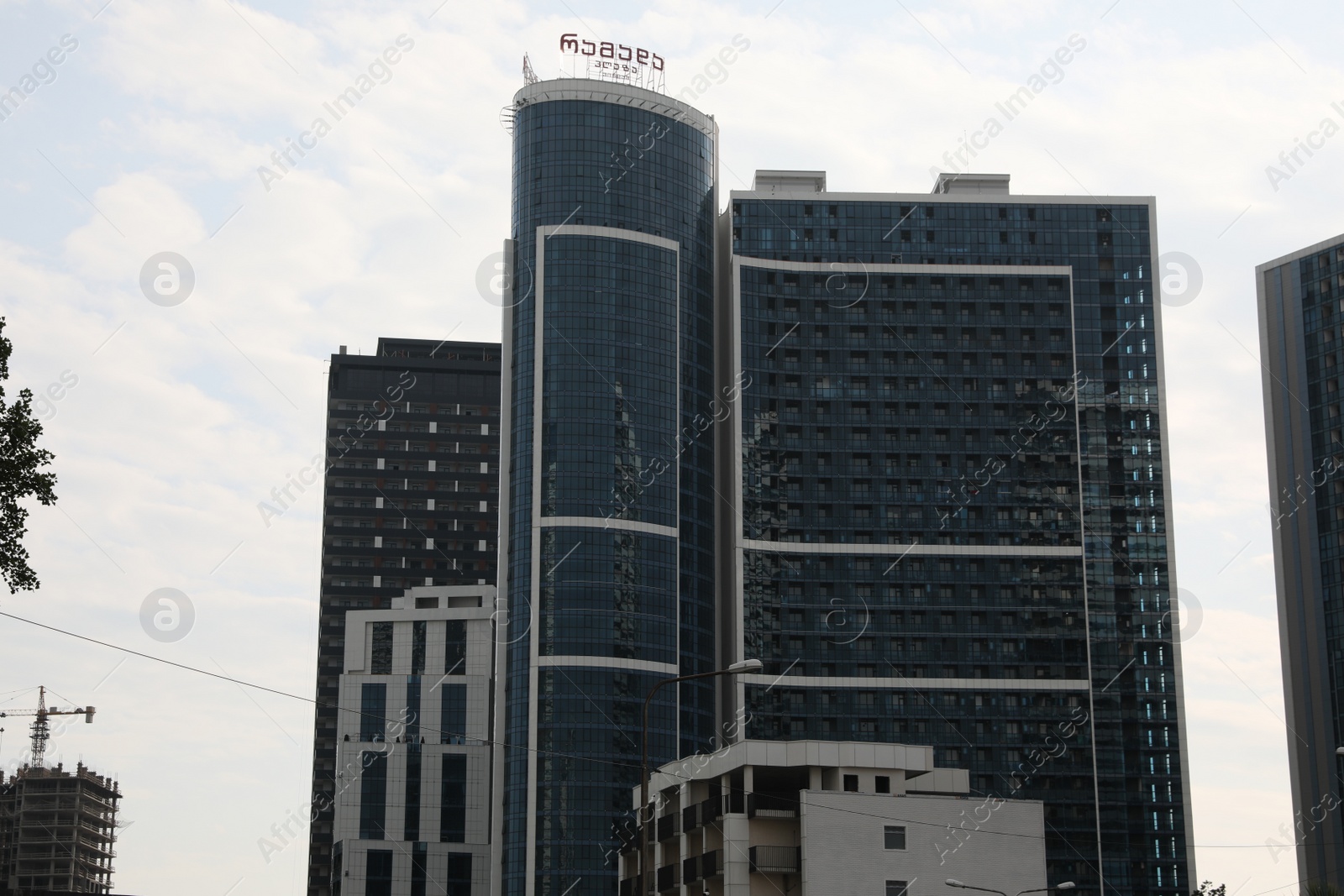 Photo of Georgia, Batumi - July 07, 2022: Modern multistory buildings under cloudy sky