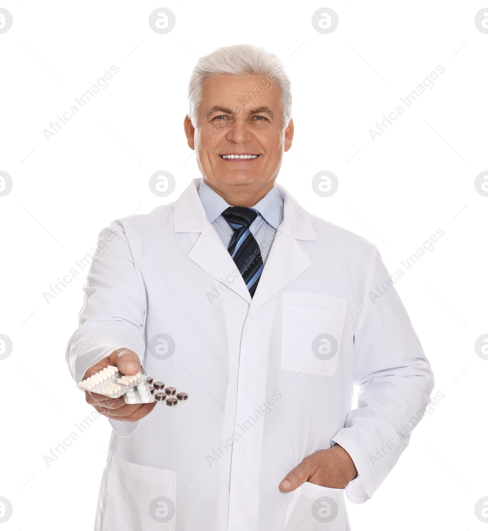 Photo of Senior pharmacist with pills on white background