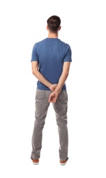 Young man in casual clothes posing on white background