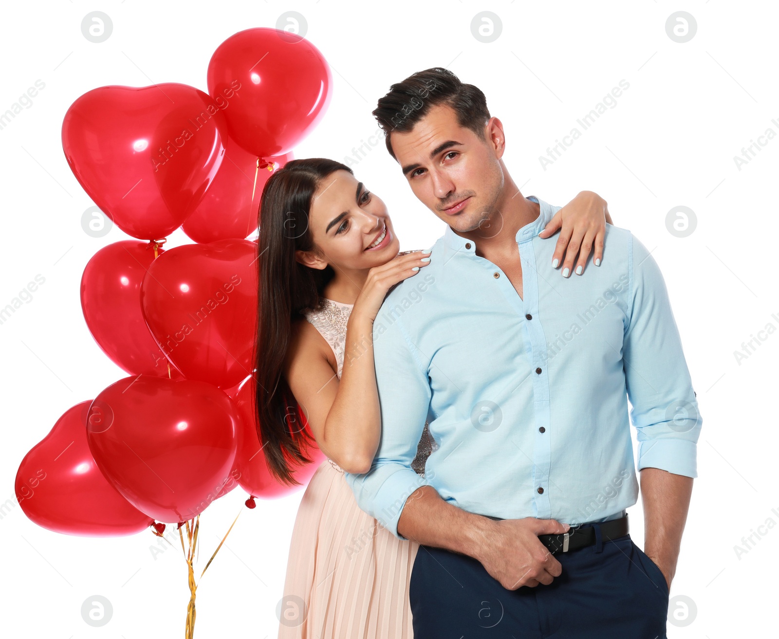 Photo of Beautiful couple with heart shaped balloons on white background