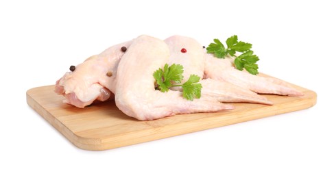 Photo of Raw chicken wings with spices and parsley on white background