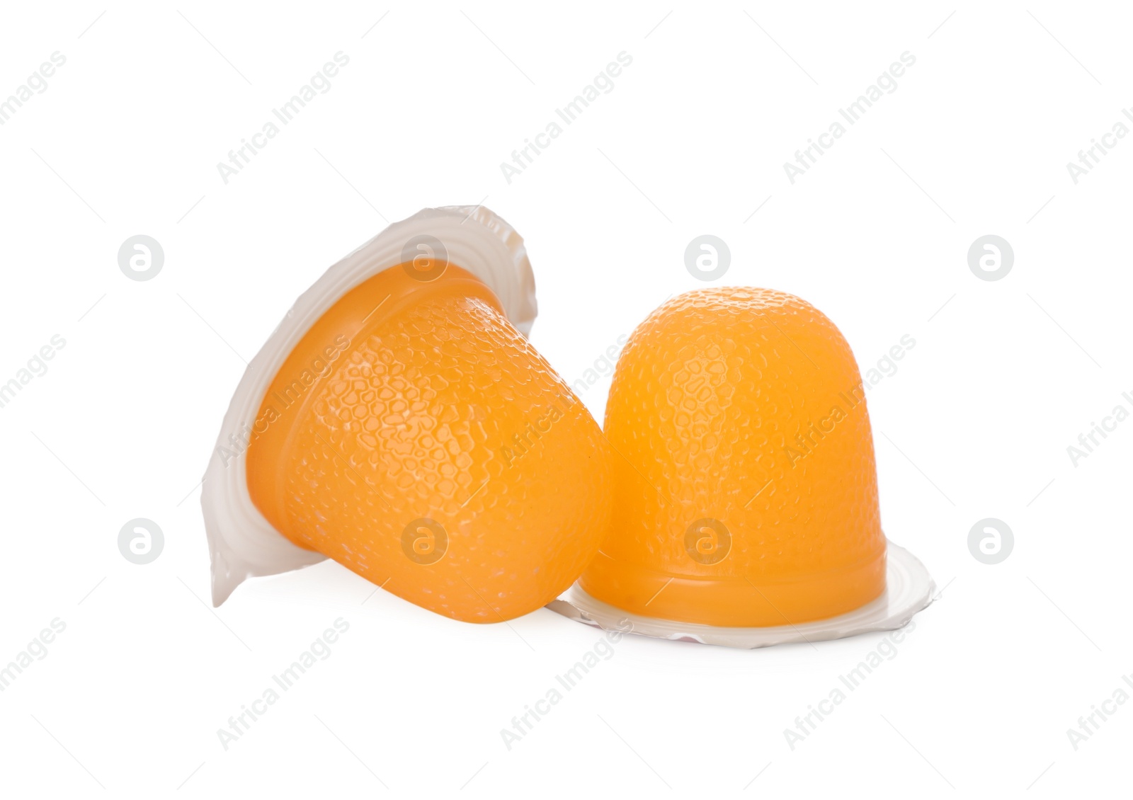 Photo of Delicious orange jelly cups on white background