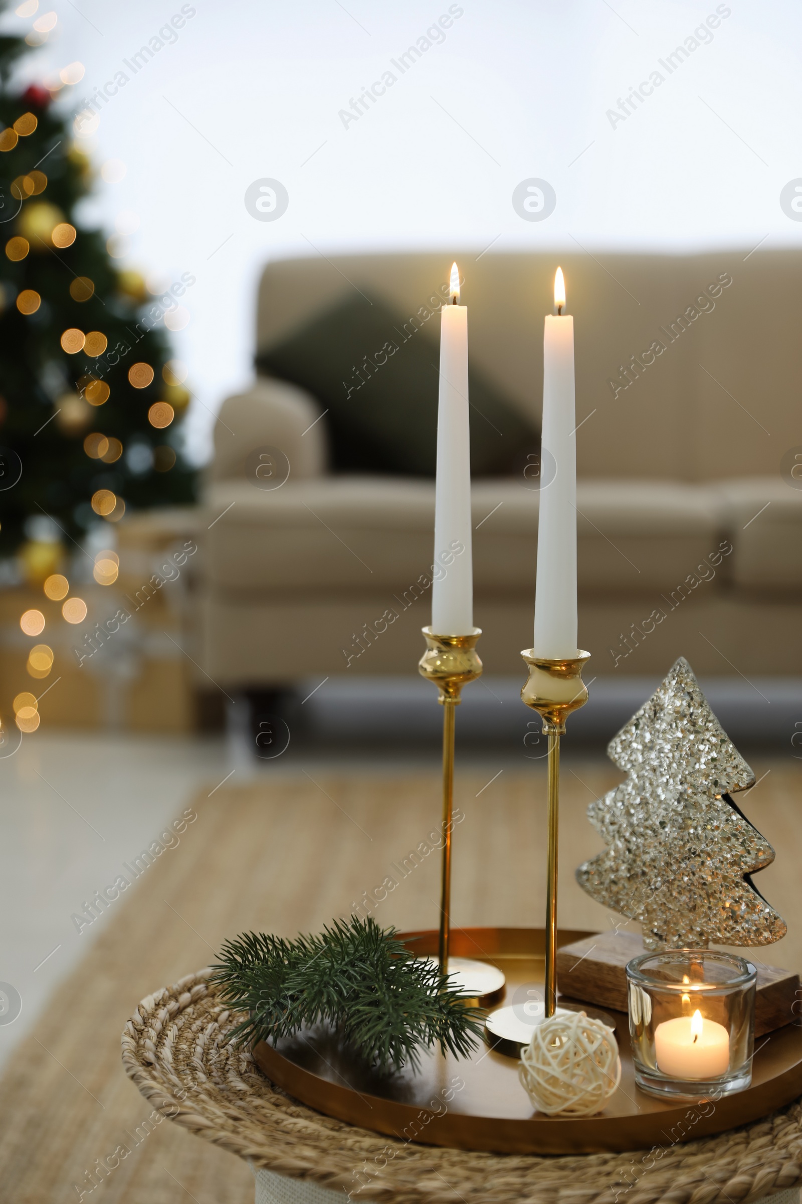 Photo of Beautiful Christmas composition with burning candles on table indoors