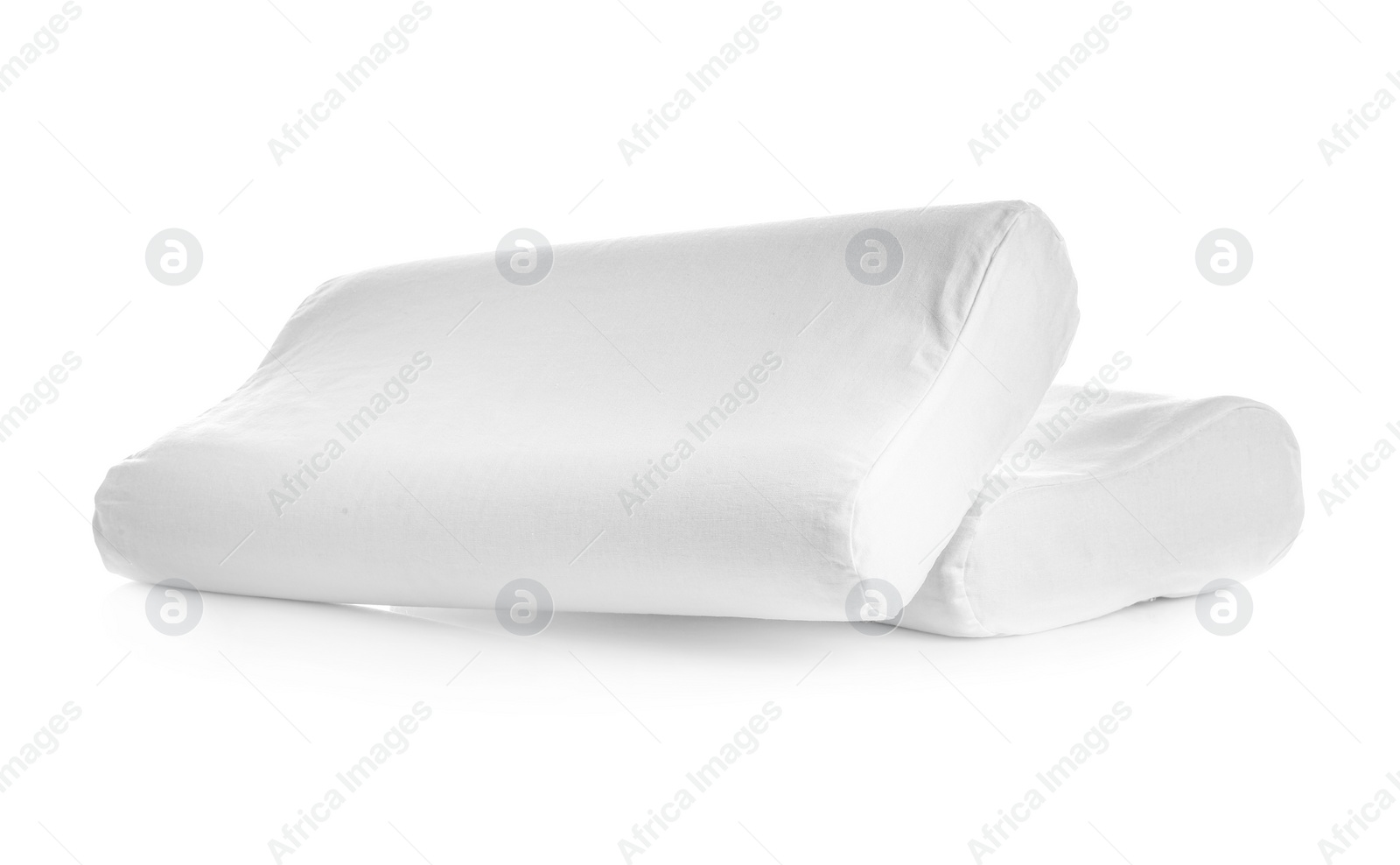 Photo of Clean soft orthopedic pillows on white background