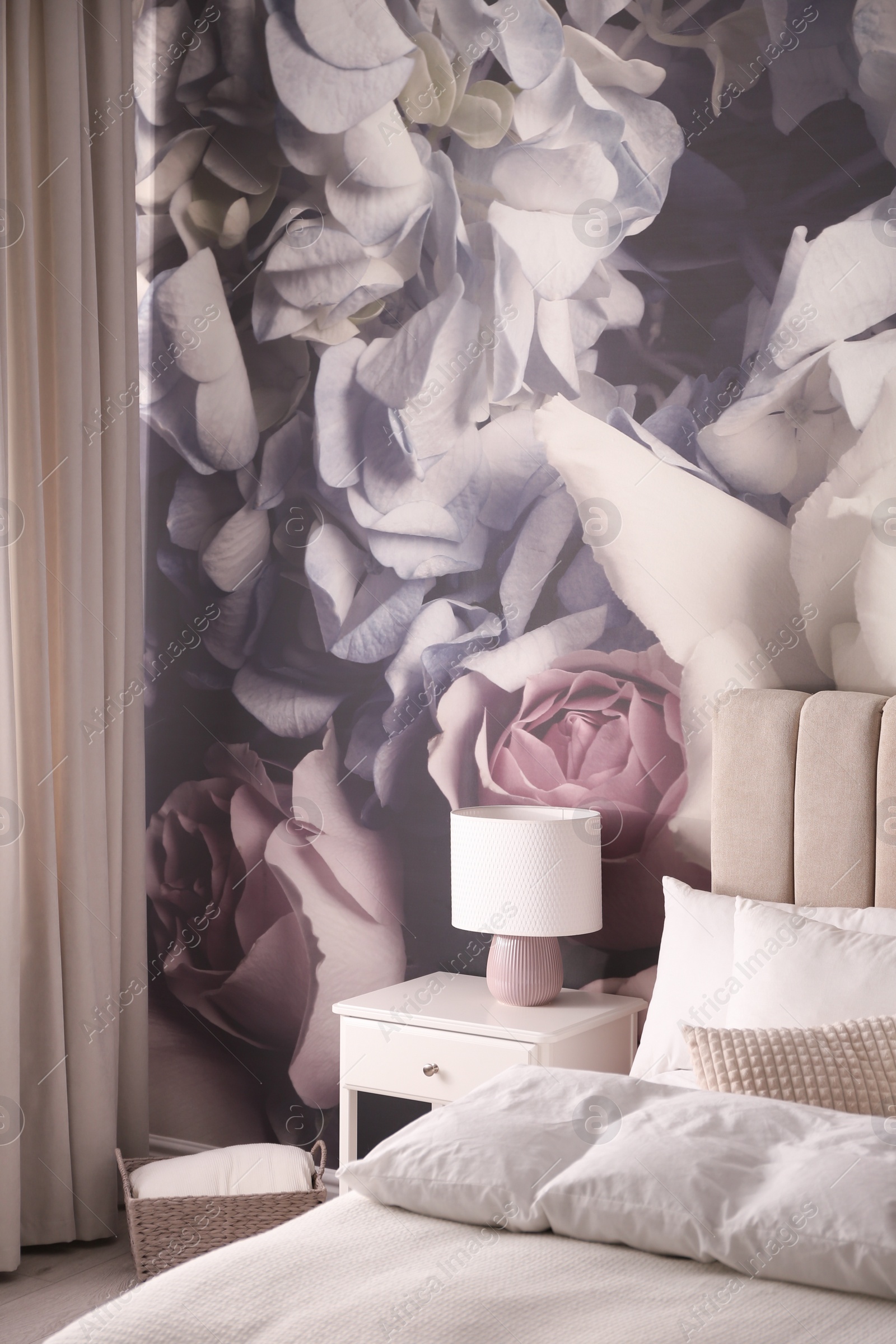 Photo of Stylish floral room interior with comfortable bed