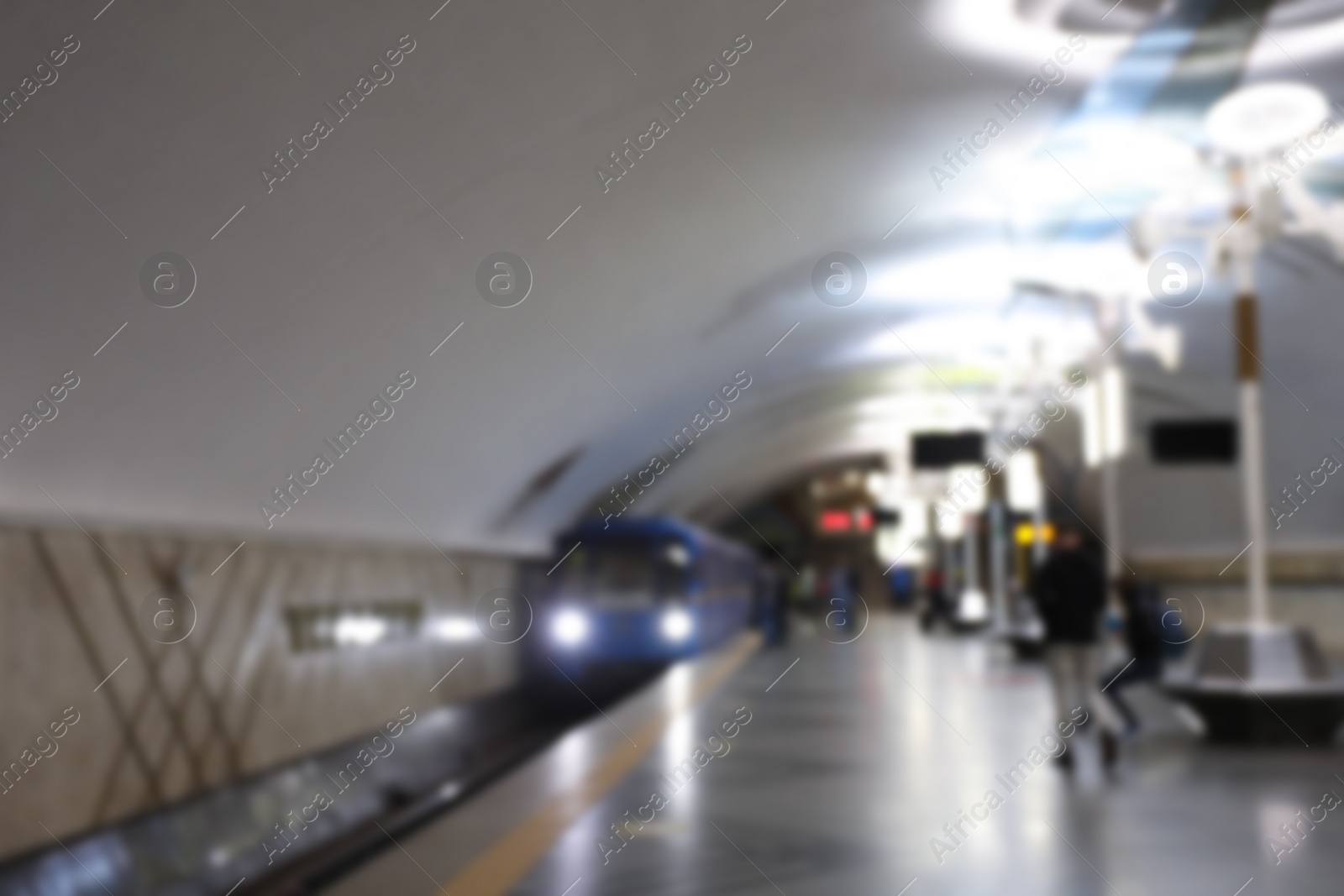 Photo of Blurred view of train pulling into subway station. Public transport