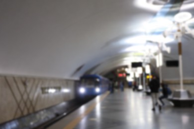 Photo of Blurred view of train pulling into subway station. Public transport
