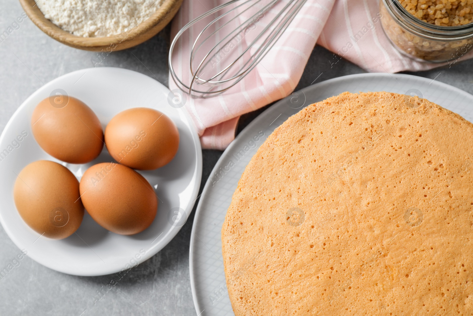 Photo of Flat lay composition with delicious fresh homemade cake on light grey marble table