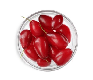 Photo of Fresh ripe dogwood berries in glass bowl on white background, top view