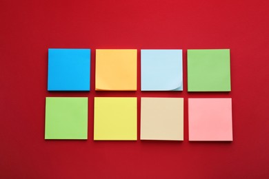 Photo of Paper notes on red background, flat lay