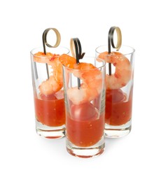 Tasty canapes with shrimps, tomatoes and sauce in shot glasses isolated on white