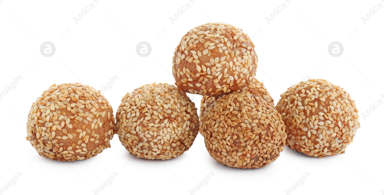 Photo of Many delicious sesame balls on white background