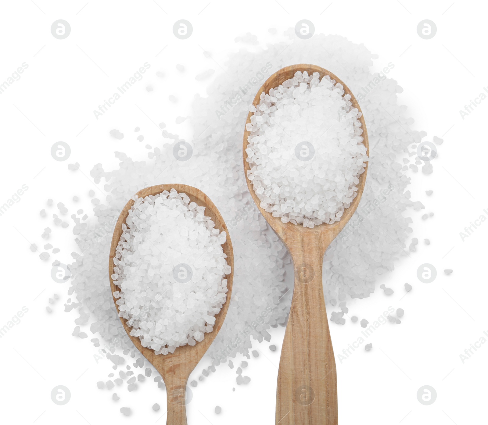 Photo of Natural salt and spoons on white background, top view