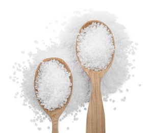 Natural salt and spoons on white background, top view