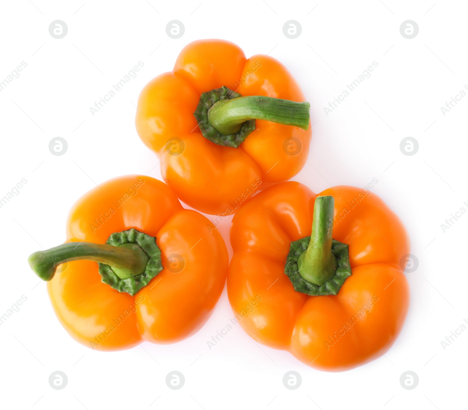 Photo of Ripe orange bell peppers isolated on white, top view