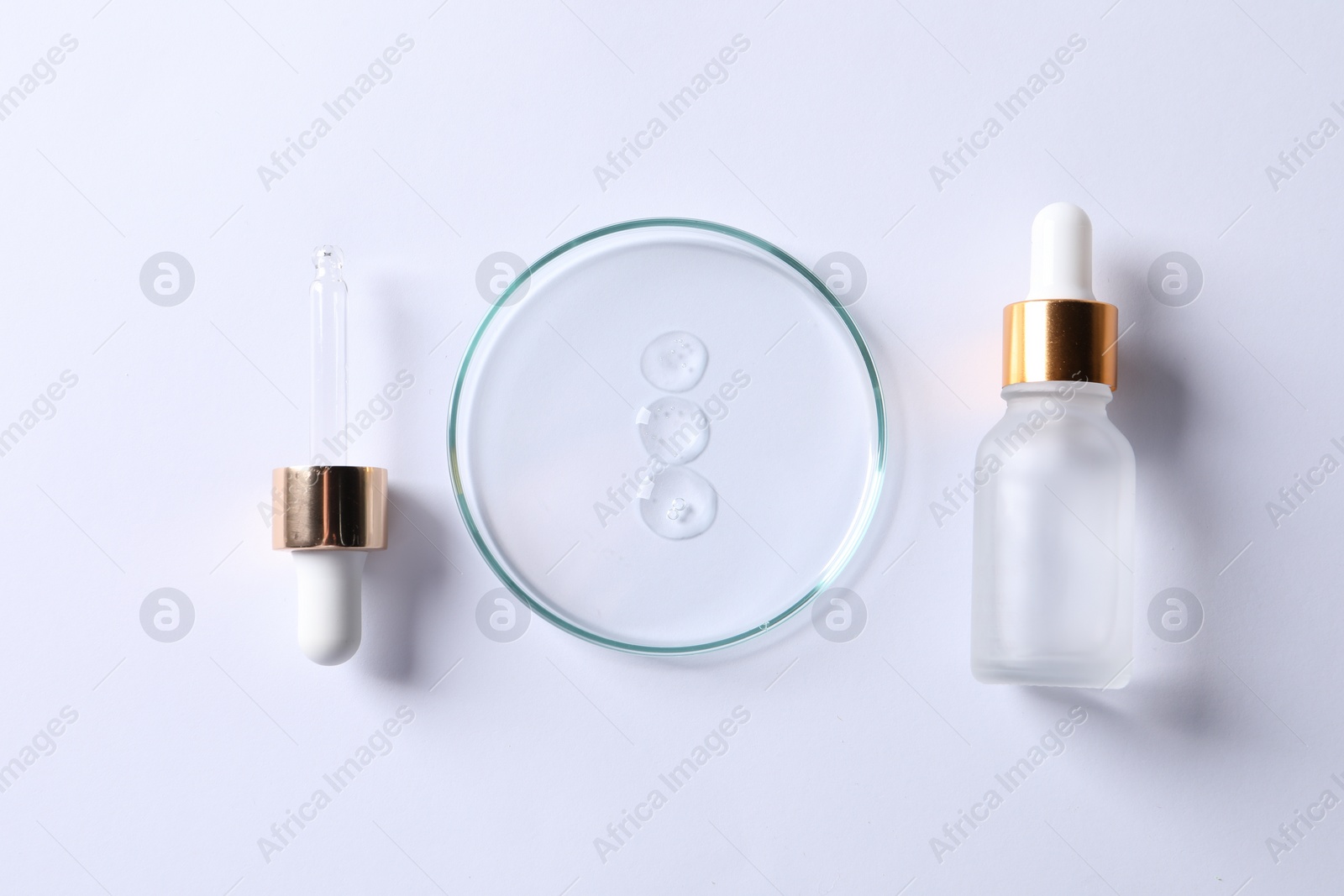 Photo of Petri dish with cosmetic serum, pipette and bottle on white background, flat lay