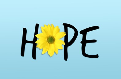 Word HOPE made with letters and beautiful yellow chrysanthemum on turquoise background