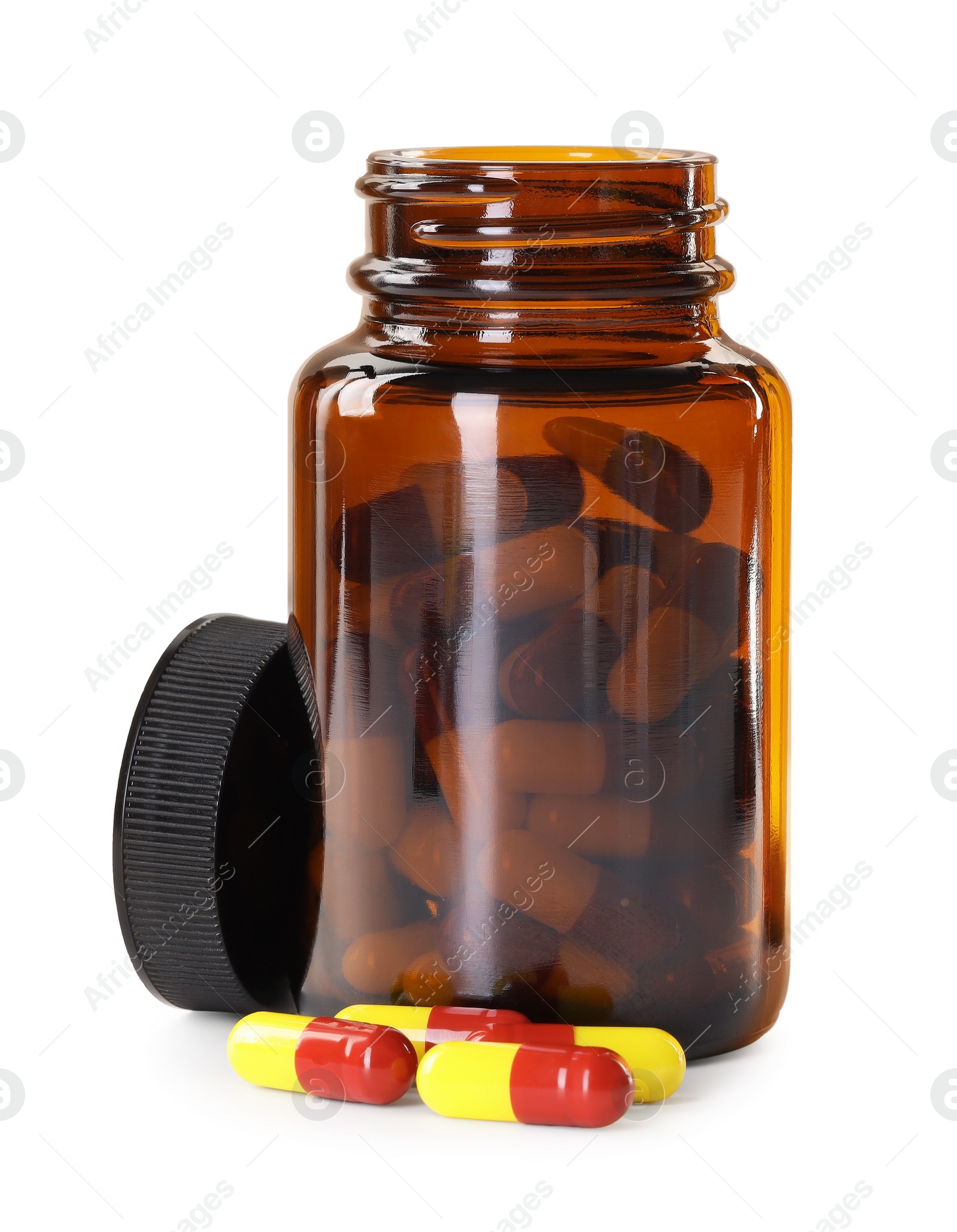 Photo of Antibiotic pills and bottle isolated on white