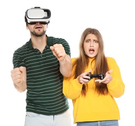 Man wearing VR headset and woman with controller playing video games isolated on white