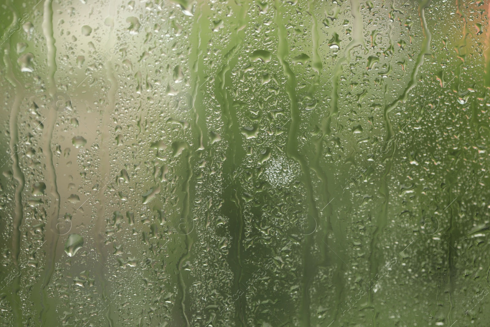 Photo of Window glass with raindrops as background, closeup