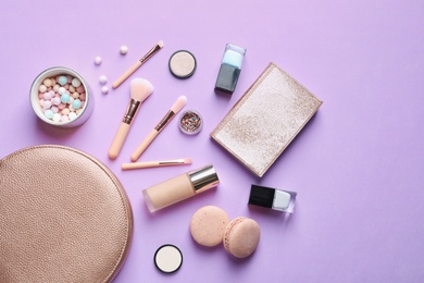 Photo of Makeup products with cosmetic bag on color background