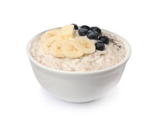 Photo of Tasty boiled oatmeal with banana, blueberries, chia seeds and butter in bowl isolated on white