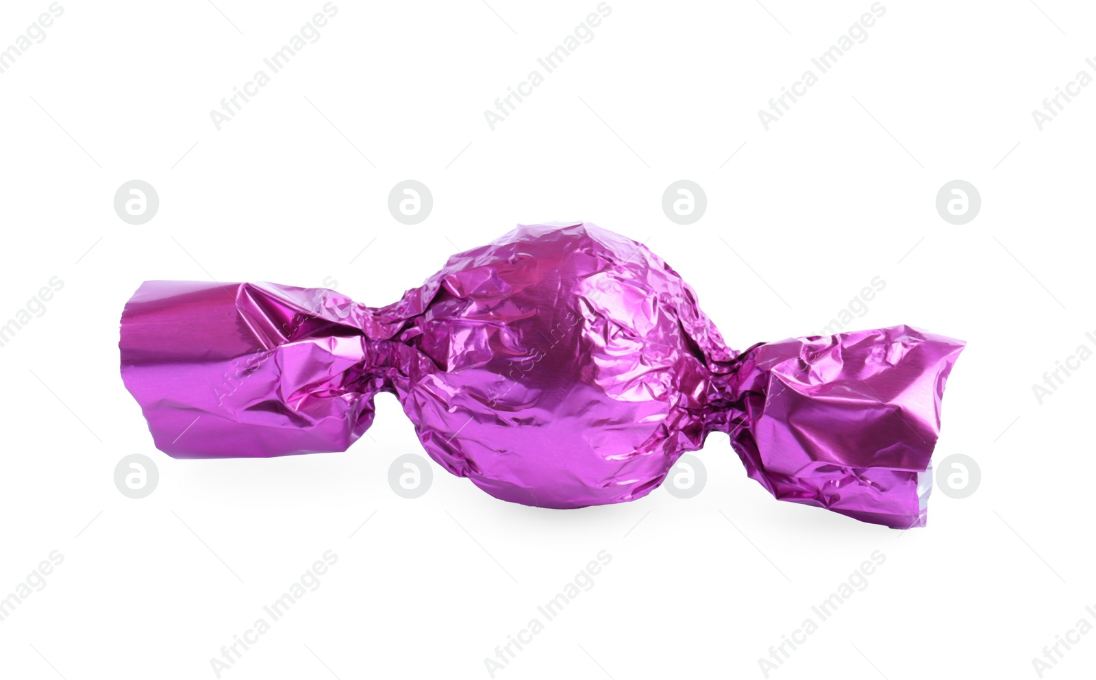 Photo of Tasty candy in violet wrapper isolated on white