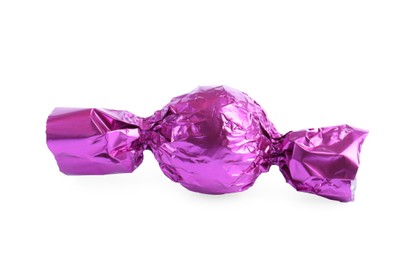 Tasty candy in violet wrapper isolated on white