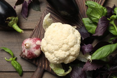 Photo of Many different vegetables on wooden table, flat lay