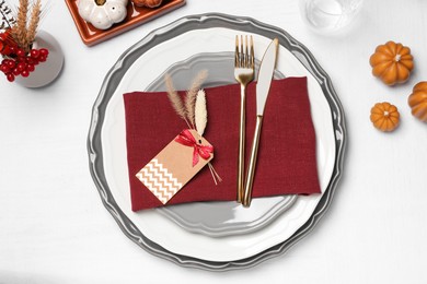 Elegant festive setting with autumn decor on table, flat lay