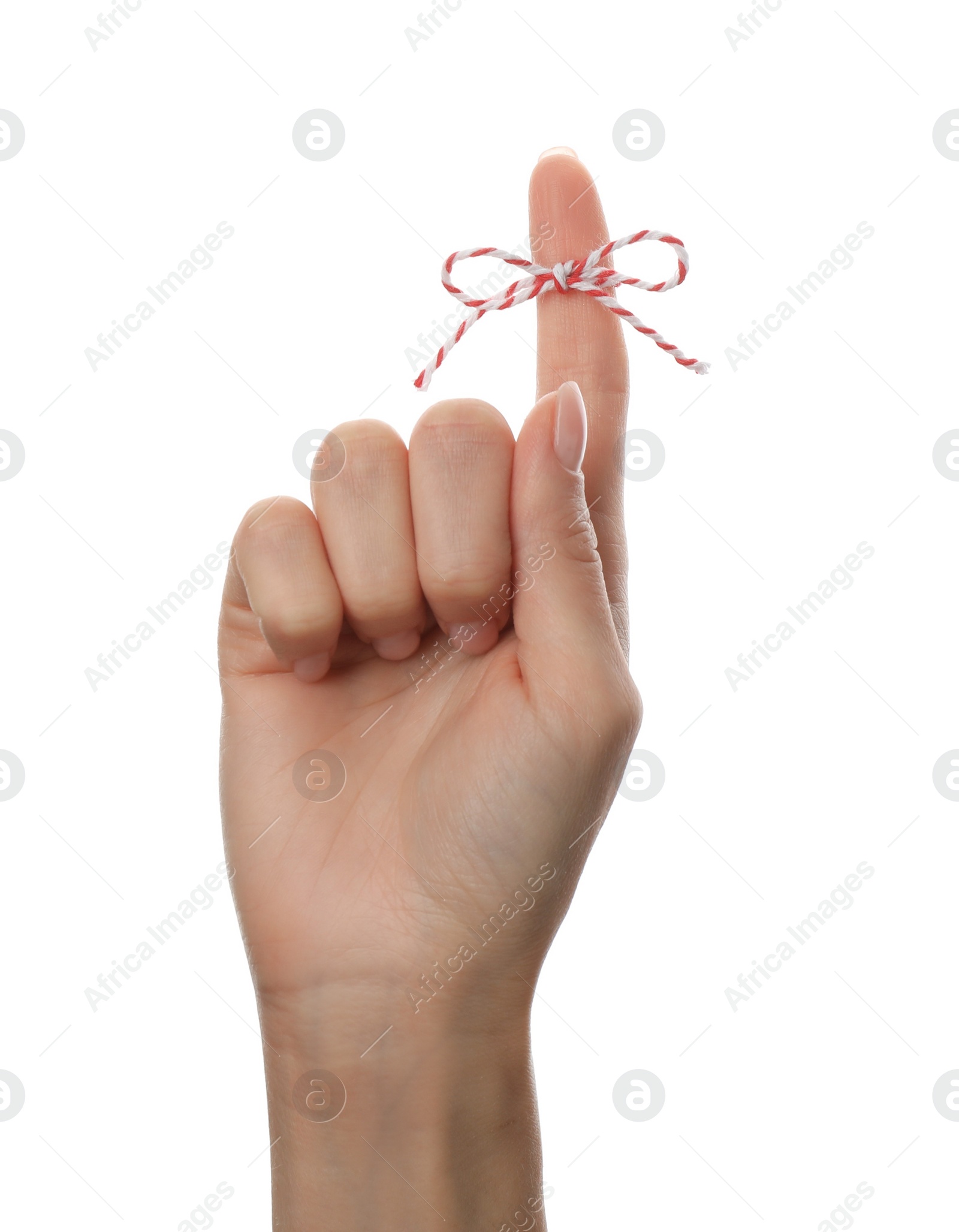 Photo of Woman showing index finger with tied bow as reminder on white background, closeup