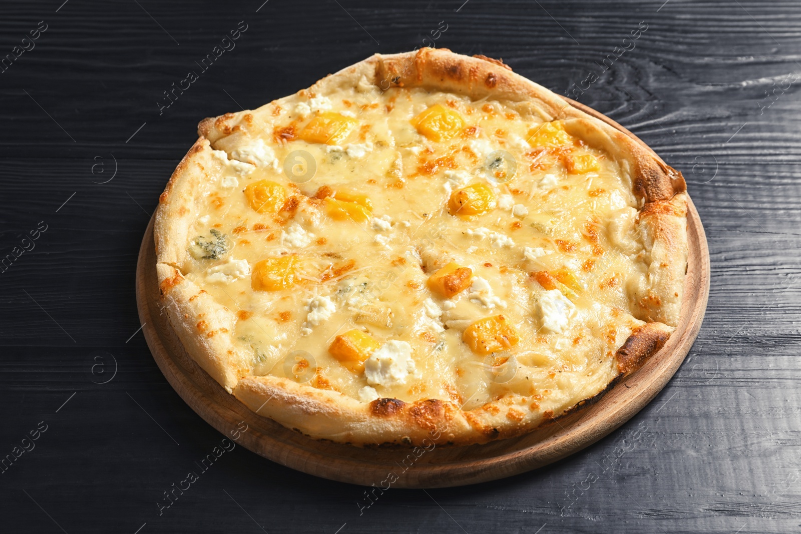 Photo of Hot cheese pizza Margherita on wooden table