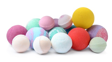 Photo of Many colorful bath bombs on white background