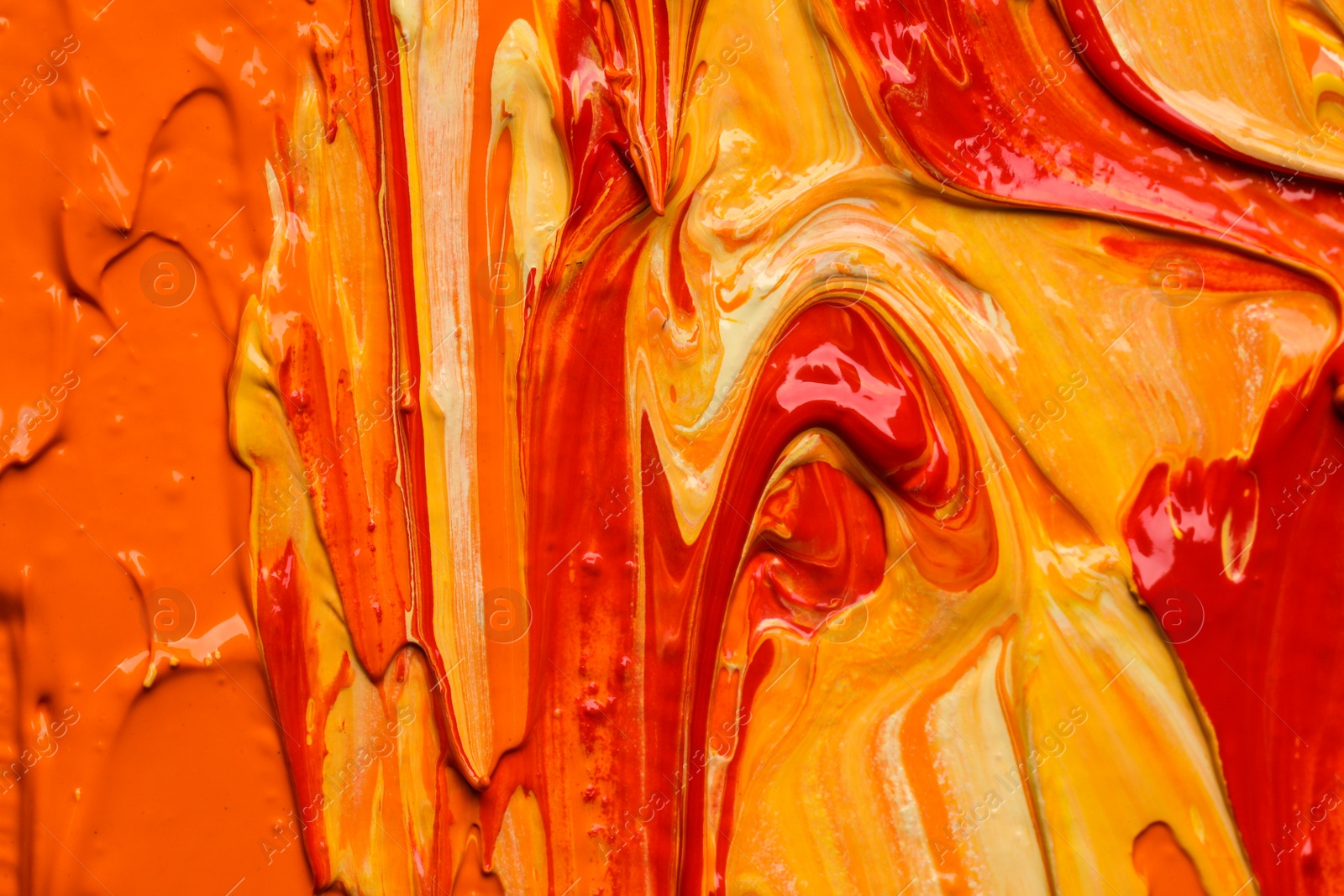 Photo of Beautiful strokes of colorful oil paints as background, closeup