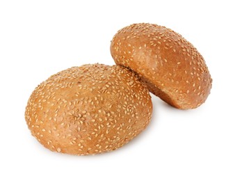 Photo of Two fresh hamburger buns with sesame seeds isolated on white