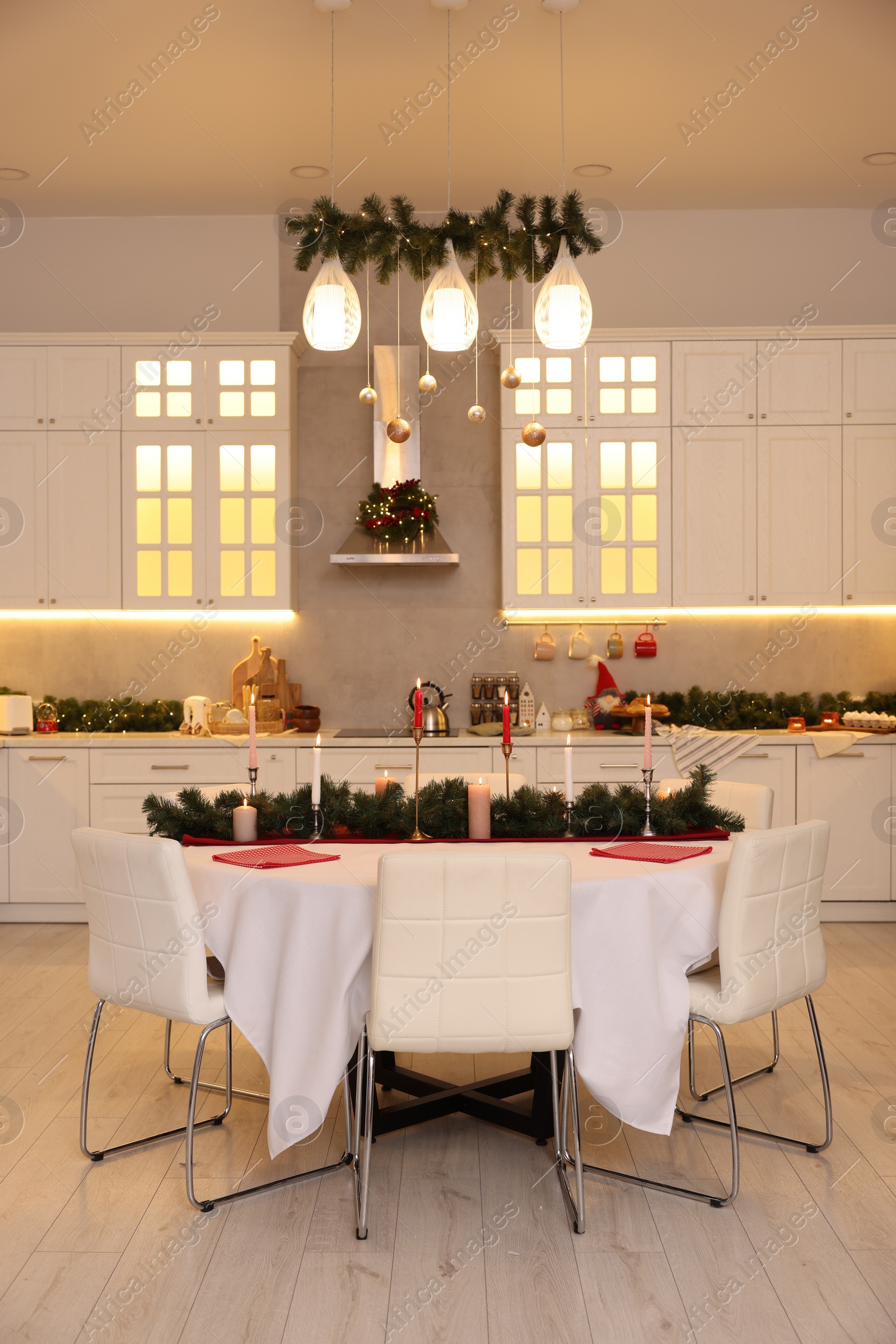 Photo of Cozy spacious kitchen decorated for Christmas. Interior design