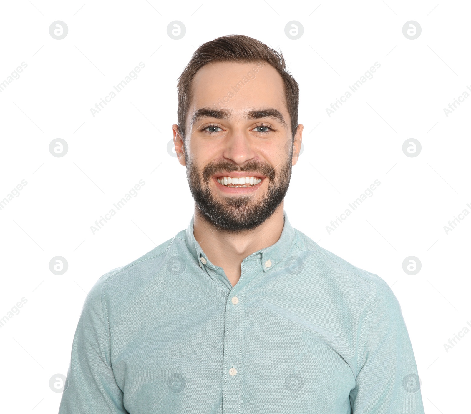 Photo of Portrait of young man laughing on white background