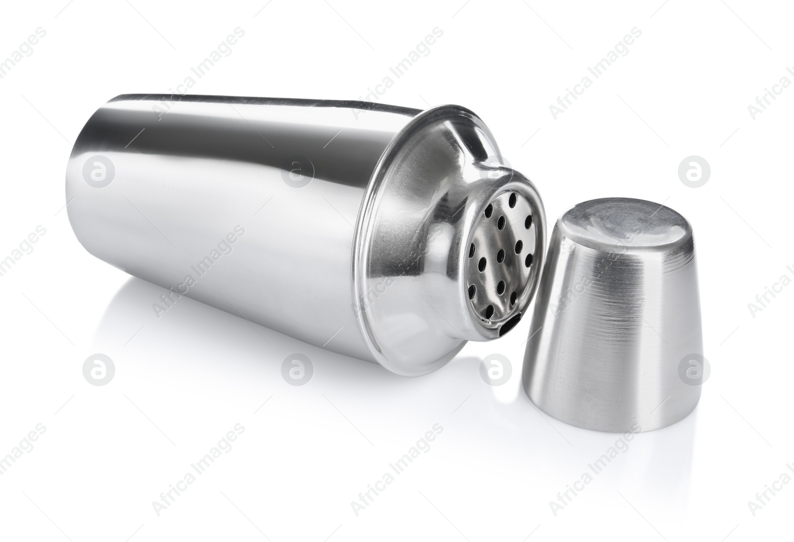 Photo of Metal cocktail shaker and cup isolated on white