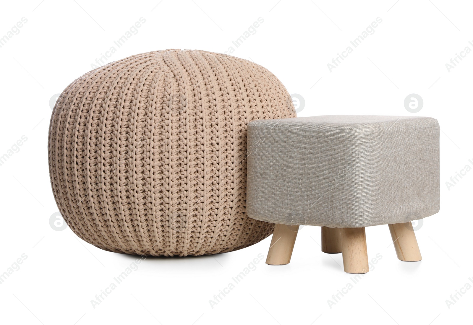 Photo of Stylish pouf and ottoman on white background. Home design