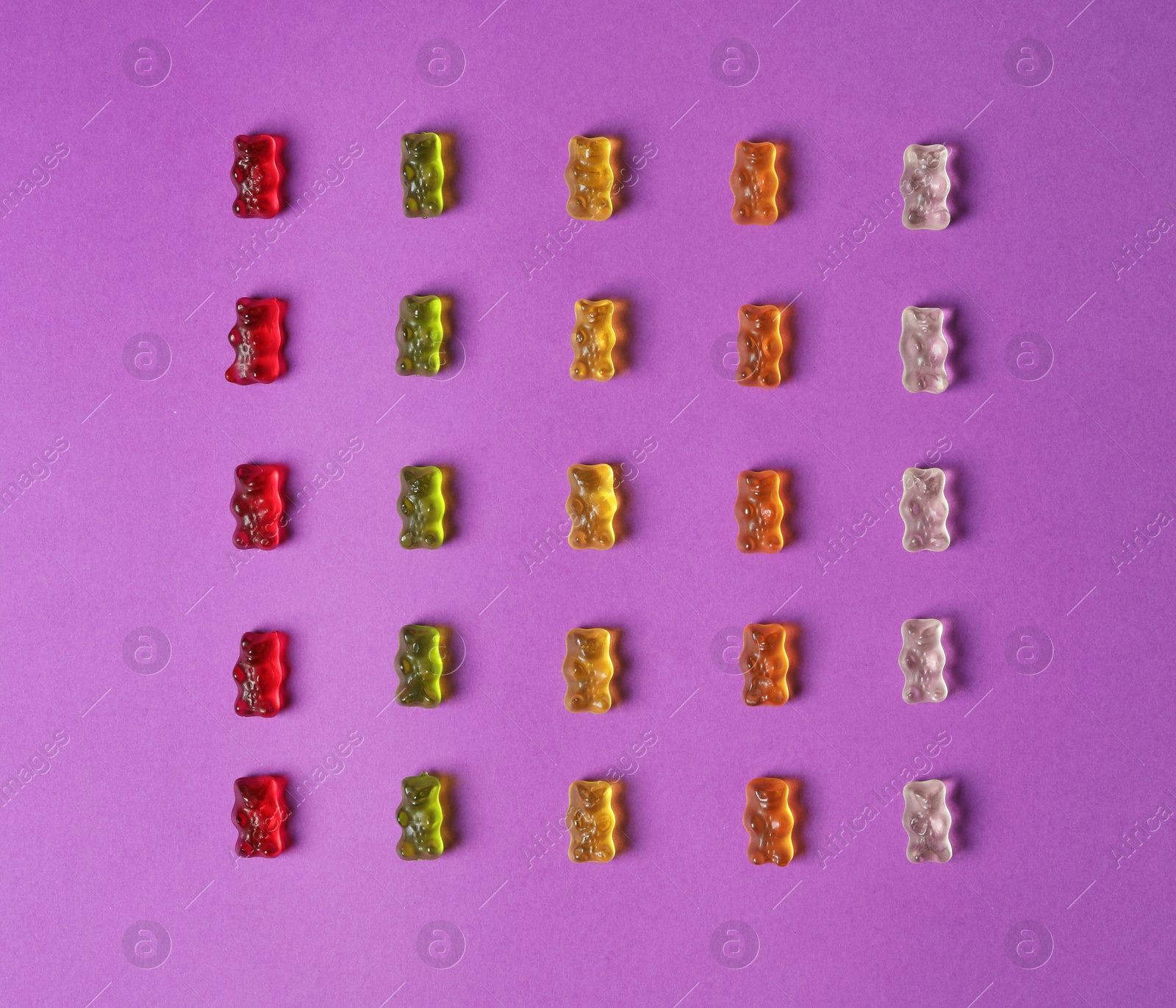 Photo of Flat lay composition with delicious jelly bears on color background