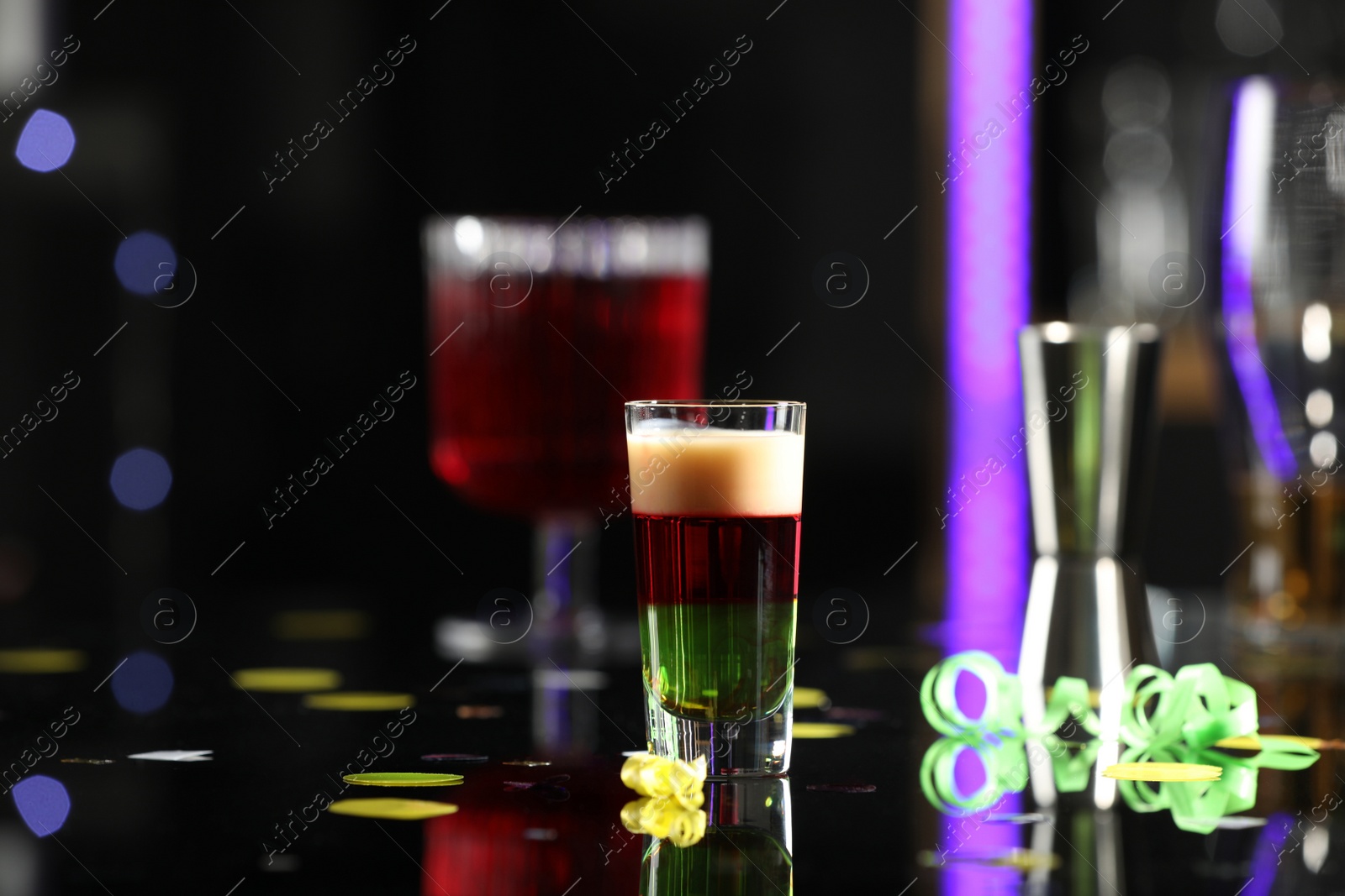 Photo of Bright delicious shot in glass on table